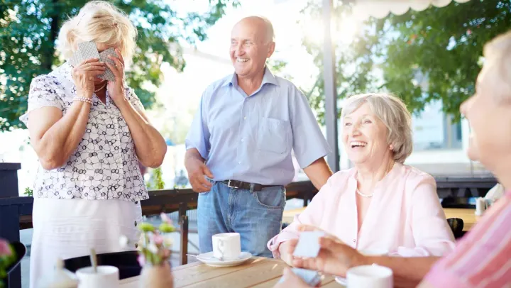 elderly group playing cards